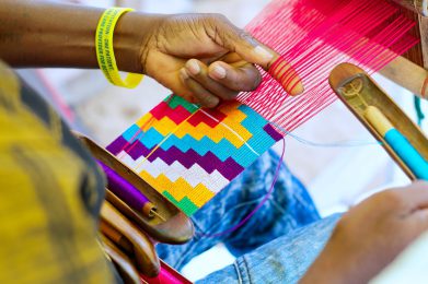 The_shuttle_being_used_to_weave_the_kente_1